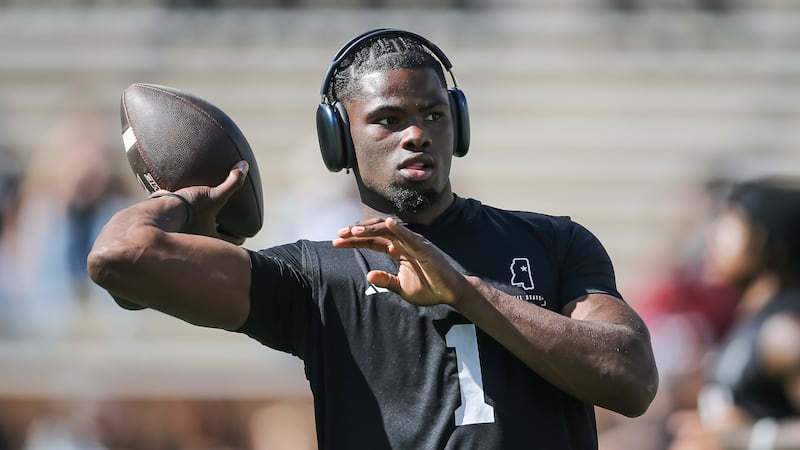 Mississippi State quarterback Kamario Taylor (1) warms up before NCAA college football game...