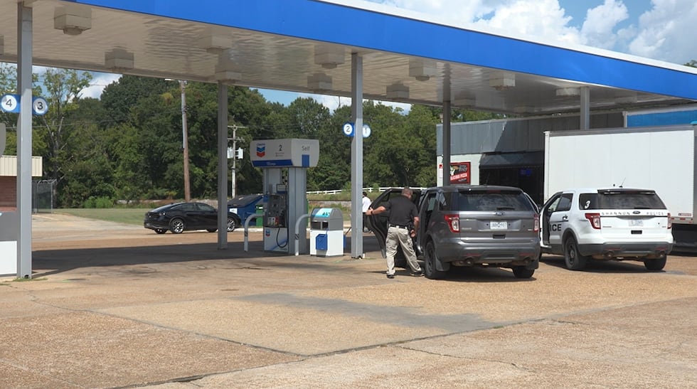 Law enforcement at a gas station in Verona, Miss. following a fatal shooting.