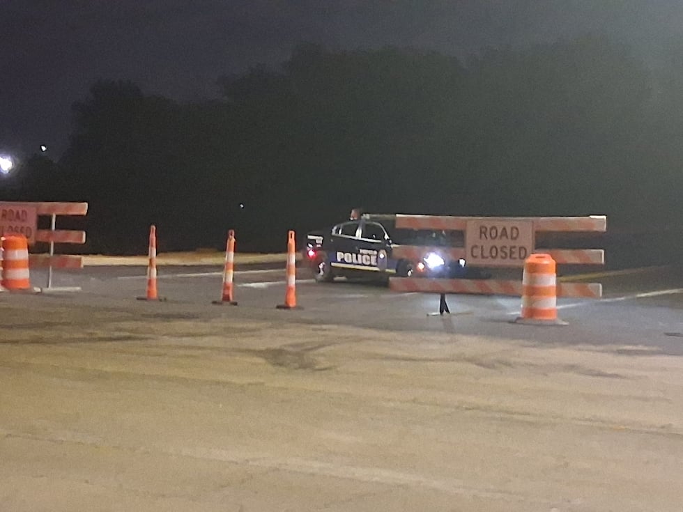 Tupelo police block the new access road off Barnes Crossing Road on Tuesday evening. Photo...