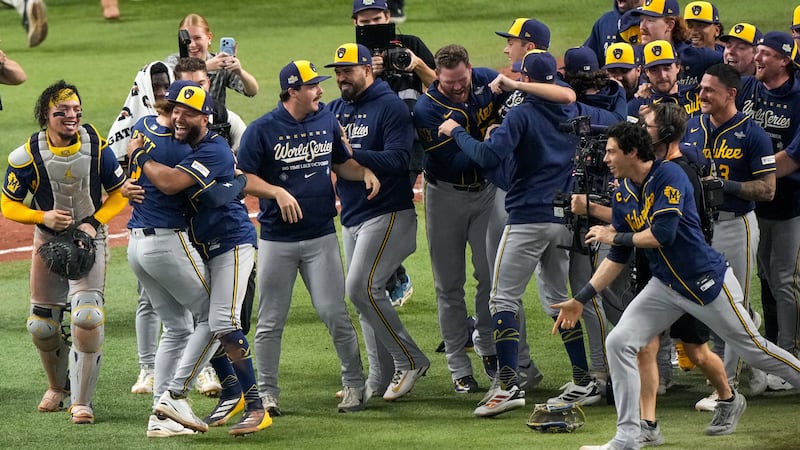 Milwaukee Brewers players celebrate after winning baseball's World Series, against the Tampa...